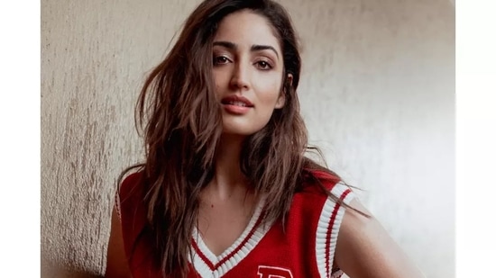 Taking to her social media handle, Yami shared a slew of pictures featuring her donning a red sleeveless pullover that came with a V-neckline and contrasting white stripes.&nbsp;(Instagram/yamigautam)