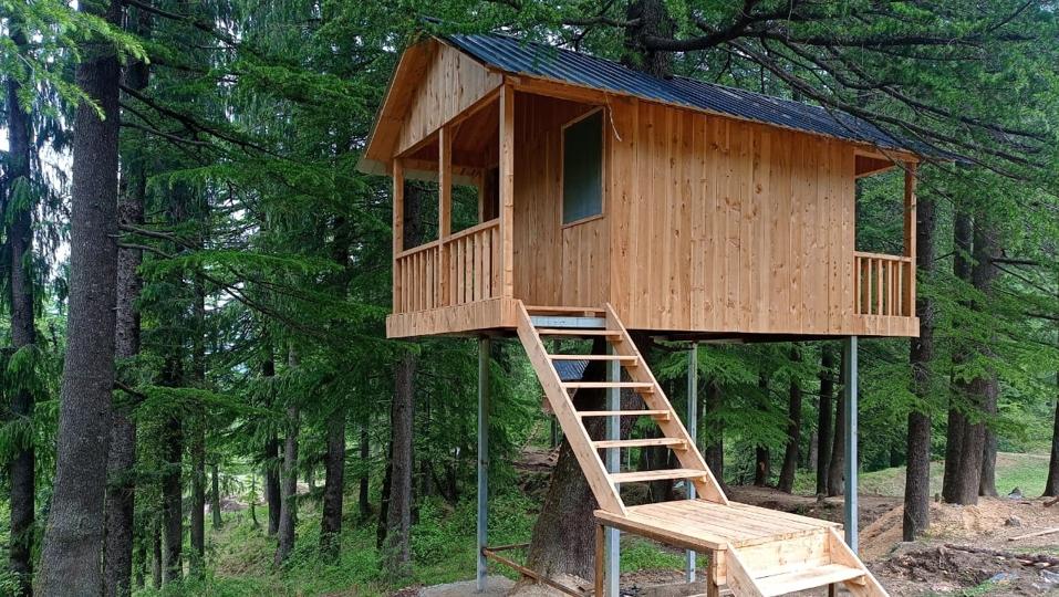 Two log huts, a water harvesting structure, an internal tank, a 5KW power generation project, bird nests, and a sales centre have been set up at the biodiversity park as well. (HT Photo) Two log huts, a water harvesting structure, an internal tank, a 5KW power generation project, bird nests, and a sales centre have been set up at the biodiversity park as well. (HT Photo)