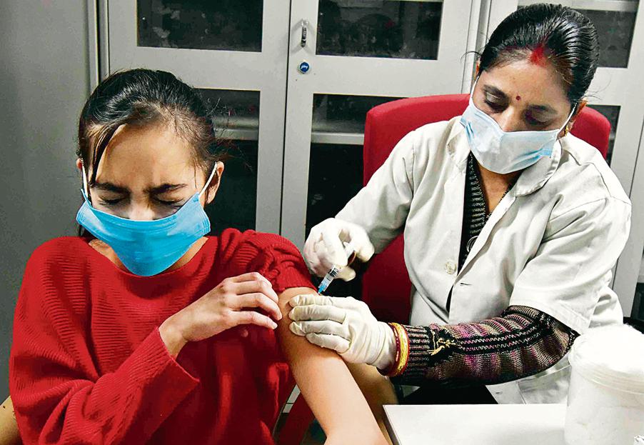 A healthcare worker inoculates a dose of the Covid-19 vaccine to a girl, at a Government Hospital, in Prayagraj. (ANI Photo) A healthcare worker inoculates a dose of the Covid-19 vaccine to a girl, at a Government Hospital, in Prayagraj. (ANI Photo)
