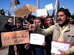 With an economic crisis gripping Afghanistan, US is seeking ways to assist while also side-stepping the Taliban. In picture - Afghan protesters hold placards and shout slogans against the US in Kabul, Afghanistan. With an economic crisis gripping Afghanistan, US is seeking ways to assist while also side-stepping the Taliban. In picture - Afghan protesters hold placards and shout slogans against the US in Kabul, Afghanistan.
