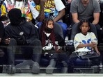 Kanye West with North and Saint.