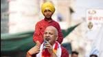 Deputy chief minister of Delhi Manish Sisodia during a roadshow in Ludhiana on Monday. He assured people that the AAP government will put an end to ‘parcha raj’ in Punjab and all fake cases will be dismissed. (HT Photo)