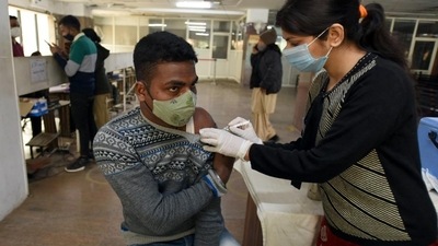 A person gets a dose of Covid-19 vaccine, at the district hospital in Noida’s Sector 30. (Sunil Ghosh /HT)