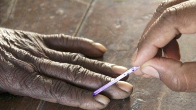 A voting official marks the finger of a voter inside a polling booth during the second phase of state polls, in Azamgarh, Uttar Pradesh. (Reuters) (For representation purpose) A voting official marks the finger of a voter inside a polling booth during the second phase of state polls, in Azamgarh, Uttar Pradesh. (Reuters) (For representation purpose)