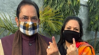 Union Minister of Minority Affairs Mukhtar Abbas Naqvi with his wife Seema Naqvi shows their ink-marked fingers after casting votes during the second phase of Uttar Pradesh Assembly elections in Rampur on February 14. (ANI) Union Minister of Minority Affairs Mukhtar Abbas Naqvi with his wife Seema Naqvi shows their ink-marked fingers after casting votes during the second phase of Uttar Pradesh Assembly elections in Rampur on February 14. (ANI)
