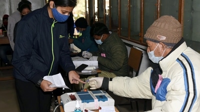 In picture - Polling official administering indelible ink to a voter. (ANI) In picture - Polling official administering indelible ink to a voter. (ANI)
