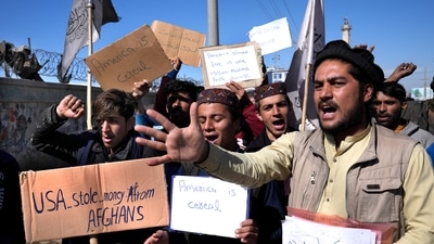 With an economic crisis gripping Afghanistan, US is seeking ways to assist while also side-stepping the Taliban. In picture - Afghan protesters hold placards and shout slogans against the US in Kabul, Afghanistan. (AP) With an economic crisis gripping Afghanistan, US is seeking ways to assist while also side-stepping the Taliban. In picture - Afghan protesters hold placards and shout slogans against the US in Kabul, Afghanistan. (AP)