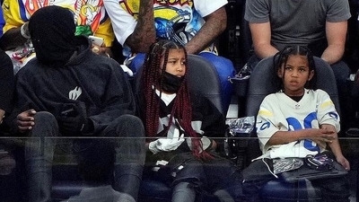 Kanye West with North and Saint. Kanye West with North and Saint.