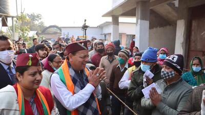Uttarakhand chief minister Pushkar Singh Dhami greets voters. (HT Photo) Uttarakhand chief minister Pushkar Singh Dhami greets voters. (HT Photo)