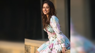 Her dress had a plunging neckline, slightly puffed sleeves and soft pleats. (Instagram/@nushrrattbharuccha)