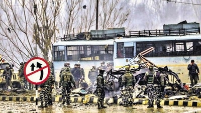 Security personnel carry out the rescue and relief works at the site of suicide bomb attack in the Pulwama district of south Kashmir. (PTI) Security personnel carry out the rescue and relief works at the site of suicide bomb attack in the Pulwama district of south Kashmir. (PTI)