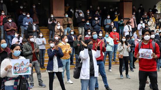 Resident doctors of Safdarjung Hospital and Lady Hardinge Hospital stage a protest against the delay in the National Eligibility Entrance Test (NEET) Postgraduate Counselling 2021, on December 30 last year. (ANI)