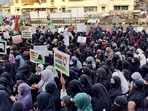 Women holding placards stage a protest in Thane against the hijab ban imposed in the few colleges in Karnataka, at Mumbra, in Thane(ANI) Women holding placards stage a protest in Thane against the hijab ban imposed in the few colleges in Karnataka, at Mumbra, in Thane(ANI)