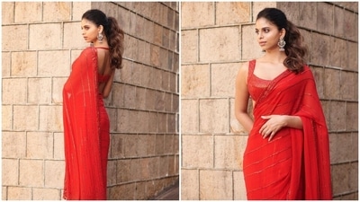 Fashionista Suhana Khan can pull off any outfit that she dons. In most of her Instagram pictures, she can be seen slaying in western outfits but today, designer Manish Malhotra treated fans with stills of the celeb kid in a red sequins saree. (Instagram/@manishmalhotra05) Fashionista Suhana Khan can pull off any outfit that she dons. In most of her Instagram pictures, she can be seen slaying in western outfits but today, designer Manish Malhotra treated fans with stills of the celeb kid in a red sequins saree. (Instagram/@manishmalhotra05)