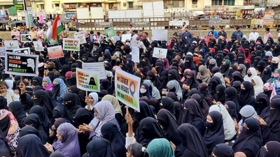 Women holding placards stage a protest in Thane against the hijab ban imposed in the few colleges in Karnataka, at Mumbra, in Thane (ANI) Women holding placards stage a protest in Thane against the hijab ban imposed in the few colleges in Karnataka, at Mumbra, in Thane (ANI)