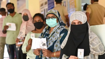 People holding their identification cards, stand in a queue to cast their votes in the Goa Assembly polls. (PTI) People holding their identification cards, stand in a queue to cast their votes in the Goa Assembly polls. (PTI)
