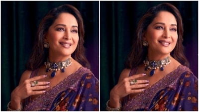 Madhuri picked a blue satin saree with floral details in red and orange and silver zari details at the borders. (Instagram/@madhuridixitnene)