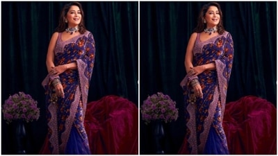 Styled by fashion stylist Ami Patel, Madhuri left her tresses open in wavy curls with a side part. (Instagram/@madhuridixitnene)