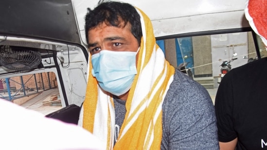 India's Olympic wrestling medallist Sushil Kumar sits inside a vehicle after he was arrested by police over alleged involvement in the murder of a fellow wrestler.&nbsp;( AFP)