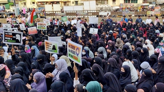 Women holding placards stage a protest in Thane against the hijab ban imposed in the few colleges in Karnataka, at Mumbra, in Thane(ANI)