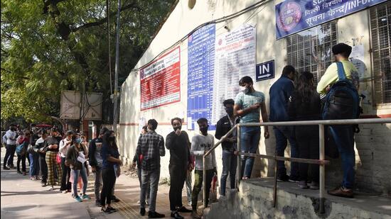 Students queue outside School of Open learning at North Campus, Delhi University on Tuesday. (Sanchit Khanna/HT Photo)