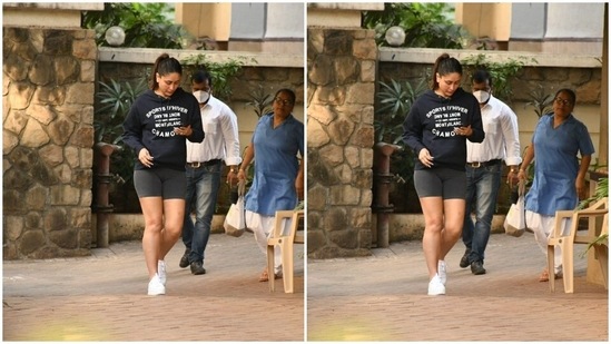 In white sneakers, Kareena was seen being busy with her phone as she made her way.(HT Photos/Varinder Chawla)