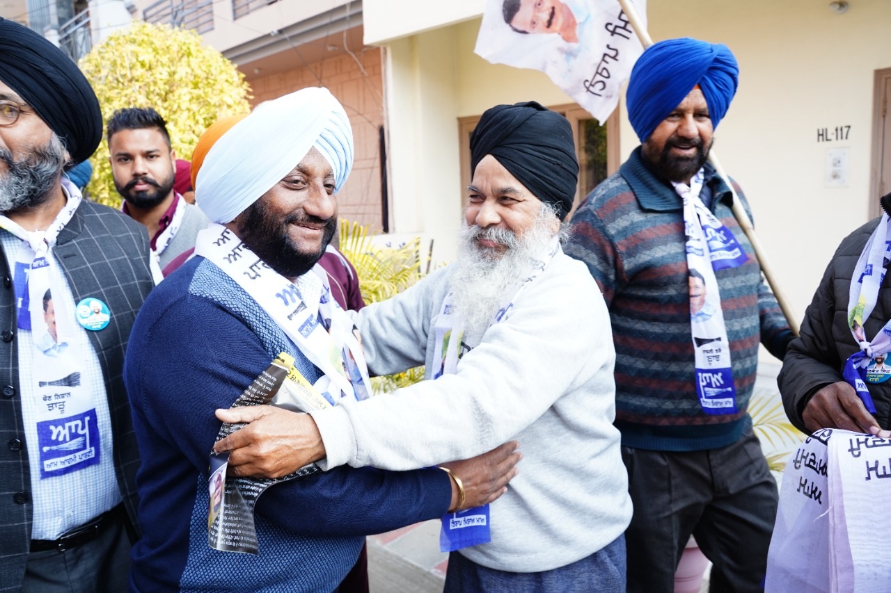 Aam Aadmi Party’s candidate Kulwant Singh greeting a voter during his election campaign in Mohali assembly segment on Tuesday. (HT Photo)