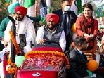 Punjab CM Charanjit Singh Channi and Congress general secretary Priyanka Gandhi Vadra during a roadshow in Ropar ahead of the Punjab Assembly elections.(ANI)
