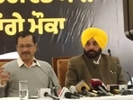AAP National convener Arvind Kejriwal along with AAP Punjab CM candidate interacting with media in a press conference in Mohali, Punjab(Ravi Kumar/HT Photo)