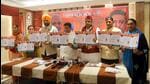 BJP candidate Sanjeev Vashisht (third from right), along with party leaders, releasing the party’s manifesto in Mohali ahead of the Punjab assembly elections. (HT Photo)
