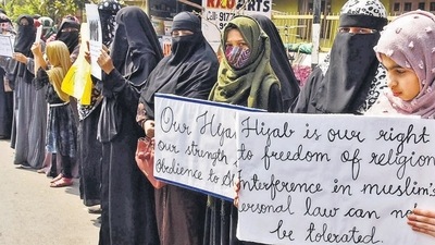 Women and girls holding placards stage a peaceful protest over the hijab ban imposed in the few colleges in Karnataka, near Shanthi Nagar Hockey Stadium, in Hyderabad on Tuesday. (ANI) Women and girls holding placards stage a peaceful protest over the hijab ban imposed in the few colleges in Karnataka, near Shanthi Nagar Hockey Stadium, in Hyderabad on Tuesday. (ANI)