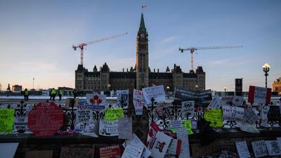 Messages and placards of support during a protest by truck drivers over pandemic health rules and the Justin Trudeau government, outside the parliament of Canada in Ottawa. (AFP) Messages and placards of support during a protest by truck drivers over pandemic health rules and the Justin Trudeau government, outside the parliament of Canada in Ottawa. (AFP)