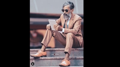 Mammikka wearing blazer and trousers with an iPad in hand is winning over the Internet.&nbsp; (shk_digital/Instagram)