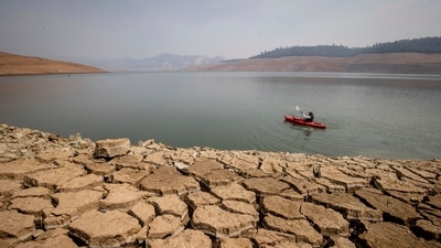 From 2000 to 2021, temperatures in the region were 0.91 degrees Celsius above the average levels from 1950 to 1999. In picture - A kayaker paddles in Lake Oroville California. (AP) From 2000 to 2021, temperatures in the region were 0.91 degrees Celsius above the average levels from 1950 to 1999. In picture - A kayaker paddles in Lake Oroville California. (AP)