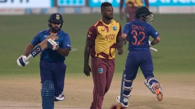 India’s captain Rohit Sharma, left, and Ishant Kishan run between the wickets to score as West Indies’ Romario Shepherd, center , looks on during the first Twenty20 international cricket match between India and West Indies in Kolkata, India, Wednesday, Feb. 16, 2022. (AP Photo/Bikas Das) (AP) India’s captain Rohit Sharma, left, and Ishant Kishan run between the wickets to score as West Indies’ Romario Shepherd, center , looks on during the first Twenty20 international cricket match between India and West Indies in Kolkata, India, Wednesday, Feb. 16, 2022. (AP Photo/Bikas Das) (AP)