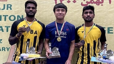 Maisnam Meirable (centre) with the trophy. Maisnam Meirable (centre) with the trophy.