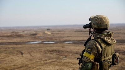 A service member of the Ukrainian armed forces takes part in tactical military exercises at a training ground in the Rivne region, Ukraine. (Reuters)
