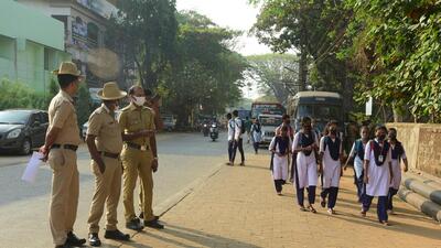 Students of government pre-university college in Kundapur town on the way to the educational institute. (AFP)