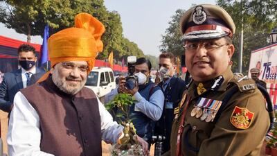 Union home minister Amit Shah being felicitated by Delhi police commissioner Rakesh Asthana during the 75th Raising Day parade of Delhi Police at Police Lines, in Delhi on Wednesday. (ANI)