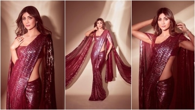 Shilpa Shetty flaunted her long toned torso in a stunning sequins maroon Manish Malhotra saree. (Instagram/@theshilpashetty) Shilpa Shetty flaunted her long toned torso in a stunning sequins maroon Manish Malhotra saree. (Instagram/@theshilpashetty)