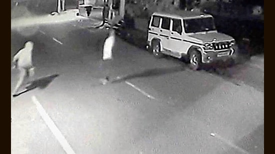 CCTV footage shows a vehicle stopping at the Garments shop at around 3.30am; two men alighted from the car and used an iron rod to break open the shutter. (HT PHOTO )