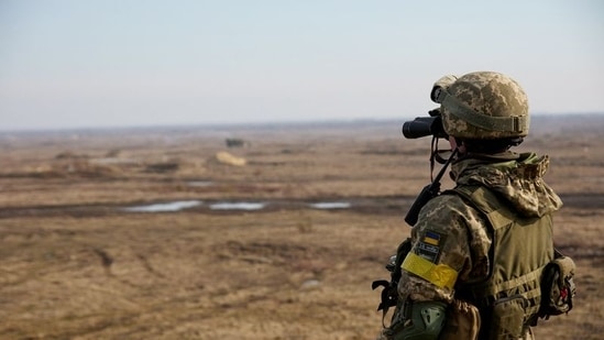 A service member of the Ukrainian armed forces takes part in tactical military exercises at a training ground in the Rivne region, Ukraine.(Reuters)