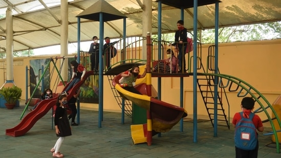 "We have re-opened for primary and upper primary classes from today and have followed all the Covid-19 guidelines for the safety of all. Students' hands have been sanitized before they entered the school premises", Sulogna Bhattacharya, Assistant Head Mistress of a primary school in Siliguri was quoted as saying by news agency ANI.(HT Photo/Samir Jana)