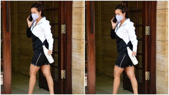 Malaika kept the styling for this athleisure look simple by ditching accessories and flaunting her natural glow. She tied her long tresses in a messy top bun, wore pink flip flops, and did not apply make-up. A face mask to keep herself safe during the ongoing Covid-19 pandemic rounded it all off.(HT Photo/Varinder Chawla)