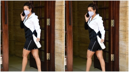 Malaika kept the styling for this athleisure look simple by ditching accessories and flaunting her natural glow. She tied her long tresses in a messy top bun, wore pink flip flops, and did not apply make-up. A face mask to keep herself safe during the ongoing Covid-19 pandemic rounded it all off.(HT Photo/Varinder Chawla)