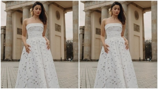 Styled by fashion stylist Ami Patel, Alia wore her tresses open in wavy curls and added a flower to one side.(Instagram/@aliaabhatt)