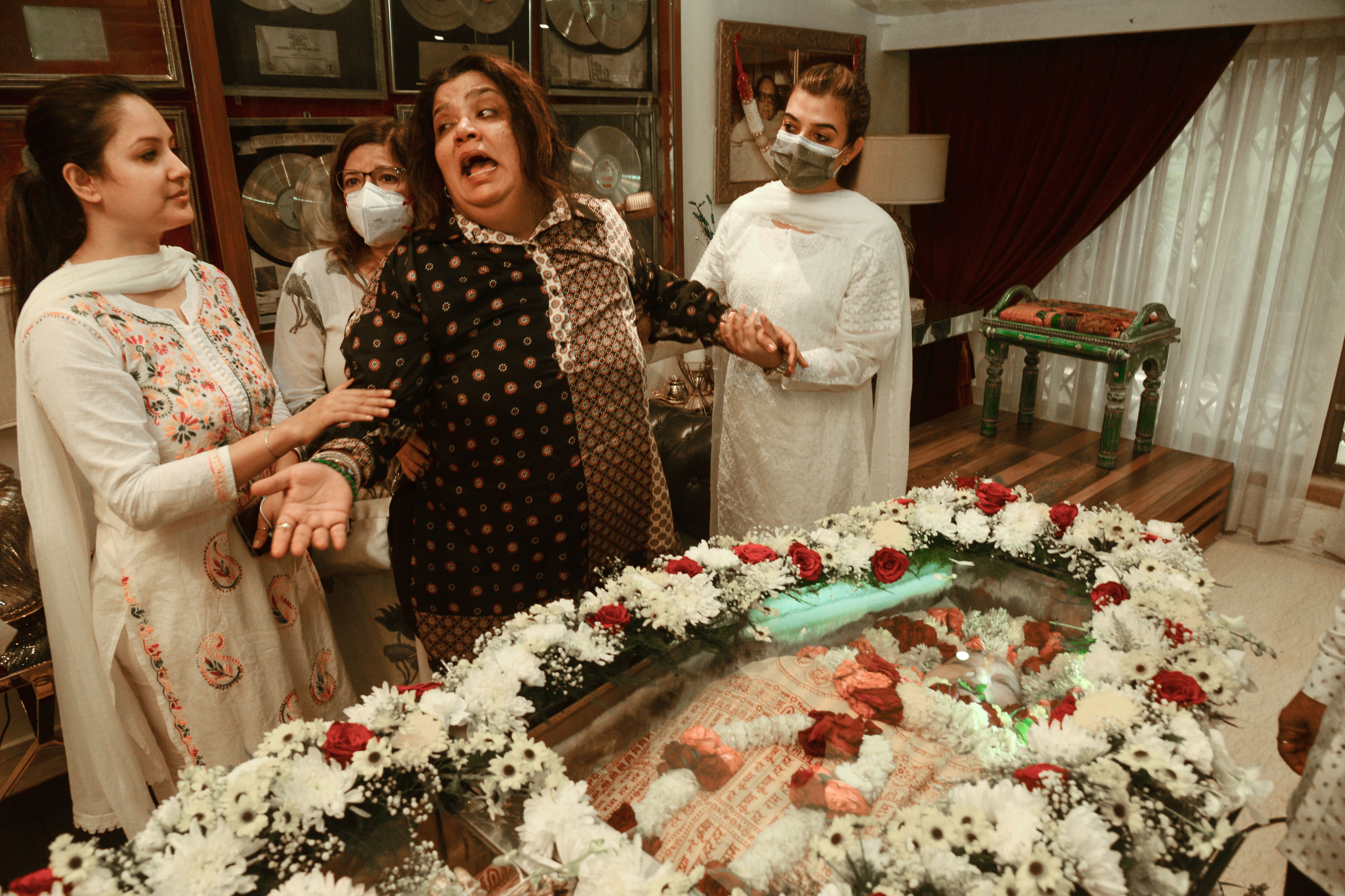 Daughter Rema mourns near the mortal remains of veteran music composer Bappi Lahiri. (PTI)