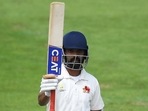 Ajinkya Rahane raises his bat after scoring half-century. Ajinkya Rahane raises his bat after scoring half-century. 