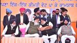 Shiromani Akali Dal patriarch Parkash Singh Badal with his son Sukhbir Badal at his home turf in Lambi on Thursday. (HT Photo)