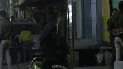 Delhi Police personnel present at the spot where an IED was found in a bag recovered in Delhi's Old Seemapuri area (ANI)